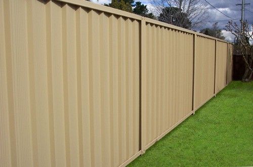 Colorbond Fencing in backyard | Concrete Coast Sleepers & Fencing Nowra - Sydney