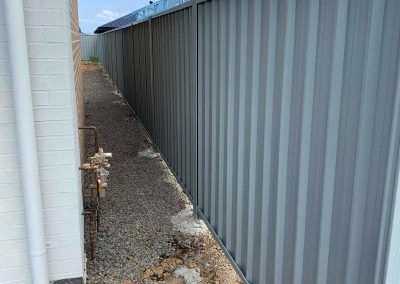 Colorbond Fencing in backyard | Concrete Coast Sleepers & Fencing Nowra - Sydney